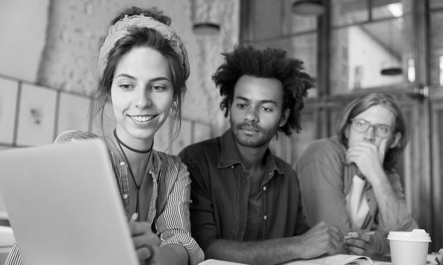 Students learning financial planning techniques in collaborative workshop setting